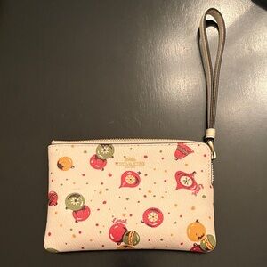 NWOT Coach Cream Wristlet with Multicolor Christmas Ornaments Print
